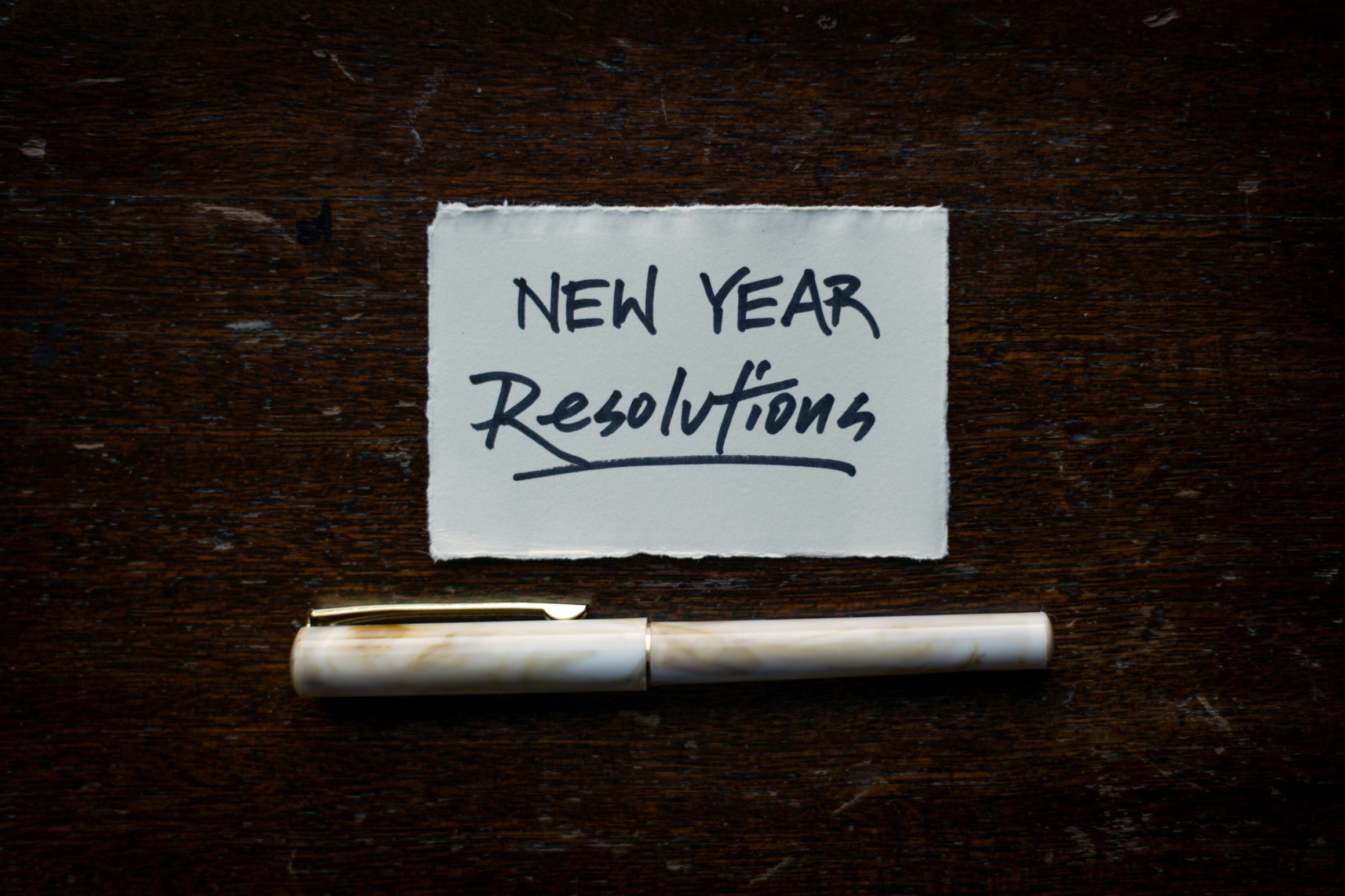 Note with New Year resolutions and a pun underneath, used to illustrate getting mortgage ready for the year ahead