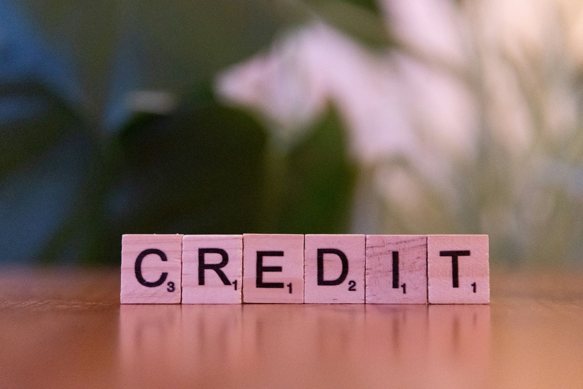 Credit spelled with wooden blocks representing a borrower’s credit file used in home loan assessments