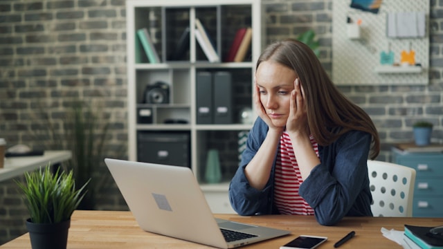 First home buyer looking stressed reviewing home loan after pre-approval declined
