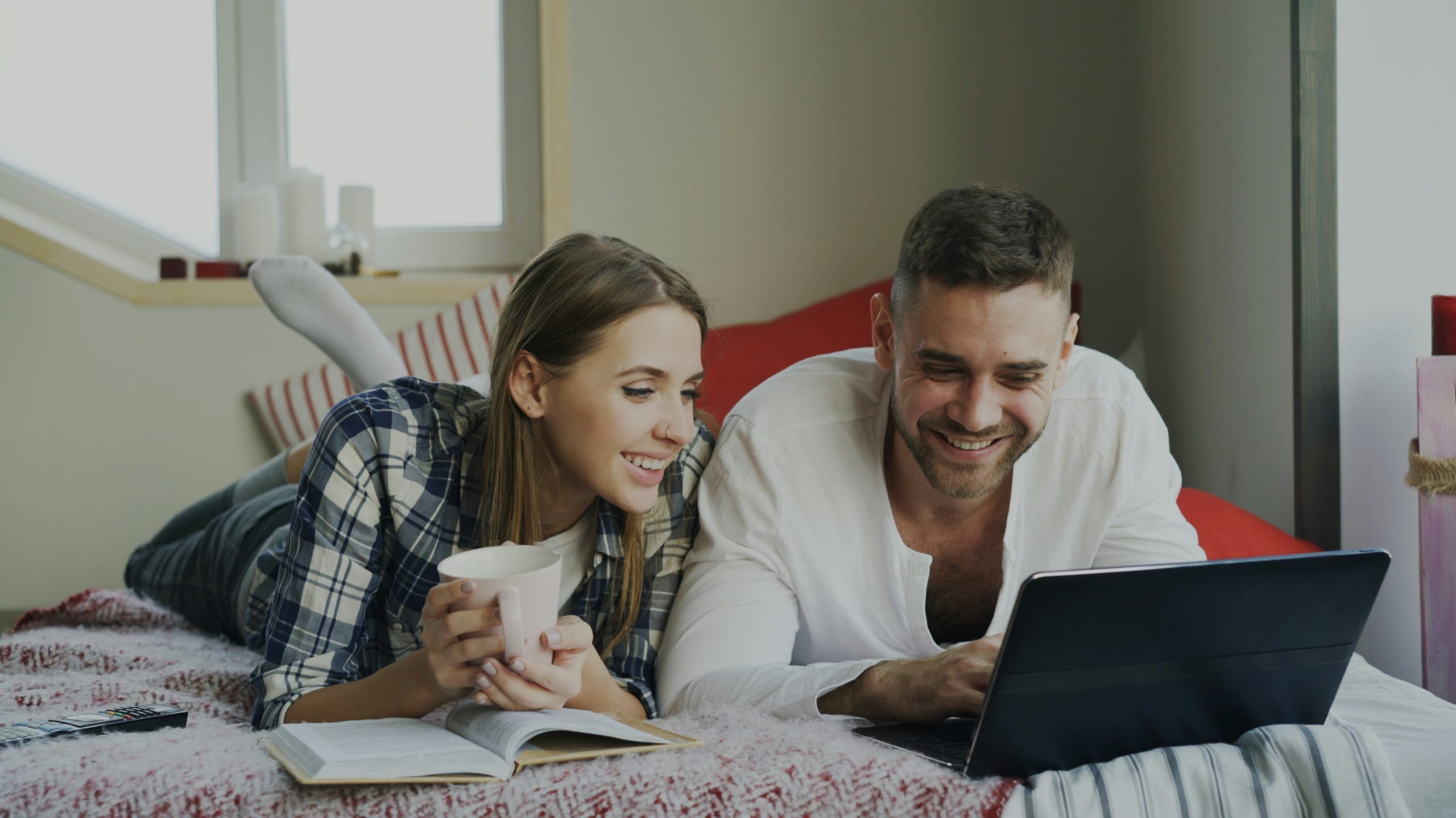Couple researching how to buy an investment property without using their savings
