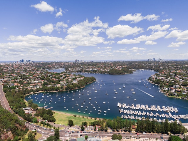 Aerial view of a residential suburb with waterfront homes, marinas and established neighbourhoods, representing property investment and home equity.
